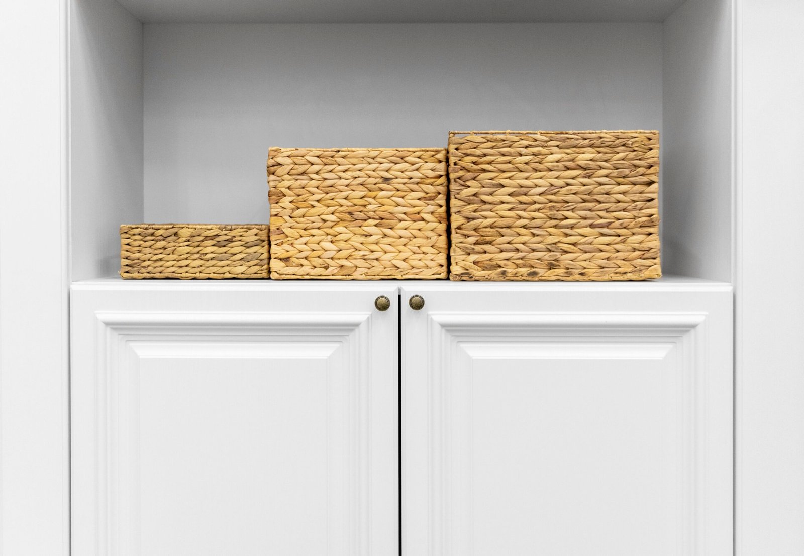 light wood and white flat front cabinets